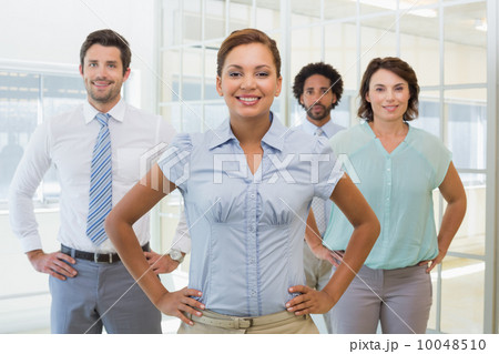Smiling young businesswoman with colleagues Smiling young businesswoman with colleagues 10048510
