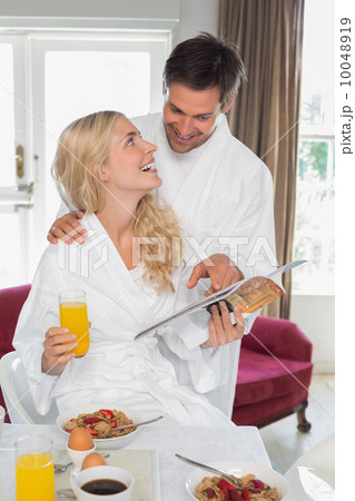Couple looking at each other while having breakfast Couple looking at each other while having breakfast 10048919