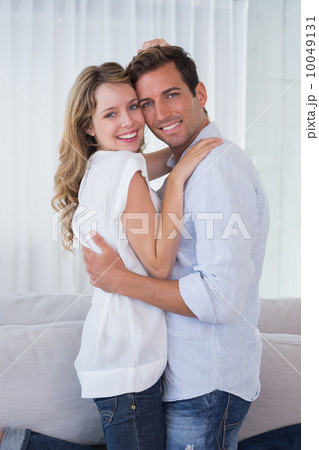 Portrait of a loving young couple embracing Portrait of a loving young couple embracing 10049131