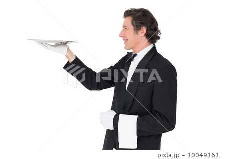 Waiter carrying tray against white background Waiter carrying tray against white background 10049161
