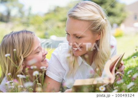 Woman and daughter lying in park Woman and daughter lying in park 10049324