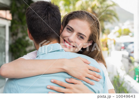 Loving young couple embracing outdoors Loving young couple embracing outdoors 10049643