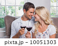 Loving young couple with wine glasses at home 10051303