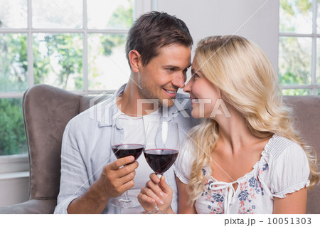 Loving young couple with wine glasses at home 10051303