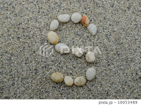 S - Letter alphabet stones laid out on the granite 10053489