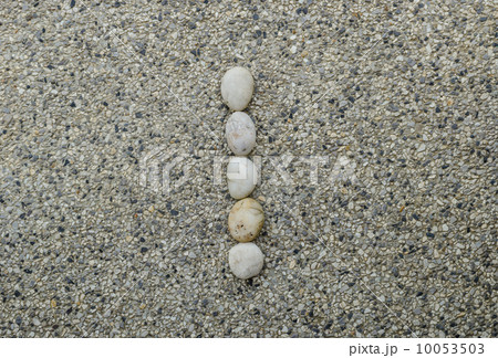 I - Letter alphabet stones laid out on the granite 10053503