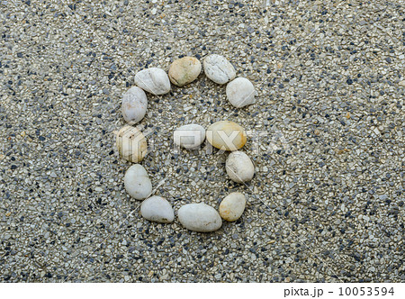 G - Letter alphabet stones laid out on the granite 10053594