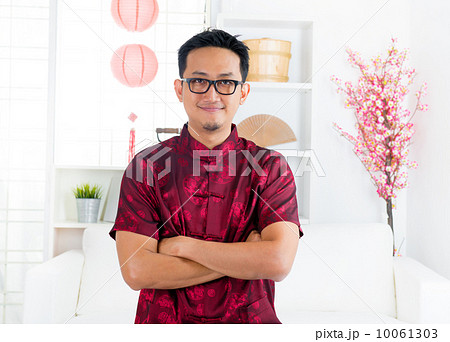 Chinese man standing indoors Chinese man standing indoors 10061303