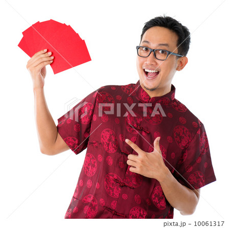 Asian Chinese man showing many red packets Asian Chinese man showing many red packets 10061317