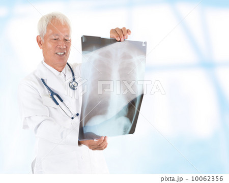 Asian senior doctor checking on x-ray image Asian senior doctor checking on x-ray image 10062356