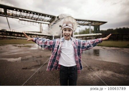 little happy boy dreaming of being pilot 10063789
