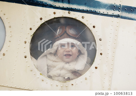 little baby dreaming of being pilot 10063813