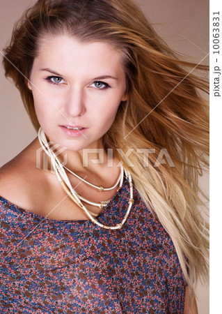 Beautiful blonde girl with long flying hair 10063831