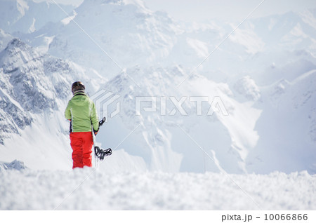 Female snowboarder at the mountains 10066866