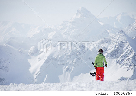 Female snowboarder at the mountains Female snowboarder at the mountains 10066867