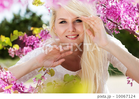 Young woman with purple flowers 10067124