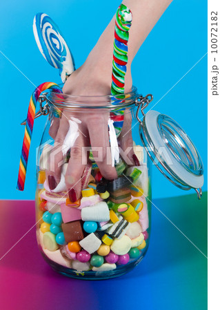 Girl with sweet goodies and candy Girl with sweet goodies and candy 10072182
