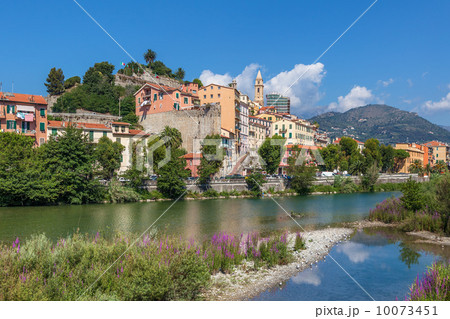 Shallow stream and old town of Ventimiglia, Italy. 10073451