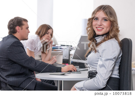 Young business lady smiling in office Young business lady smiling in office 10073818