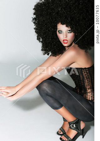 Vogue. Gorgeous Nifty Woman in Frizzy Artificial Wig. Fancy Dress Party Vogue. Gorgeous Nifty Woman in Frizzy Artificial Wig. Fancy Dress Party 10077635