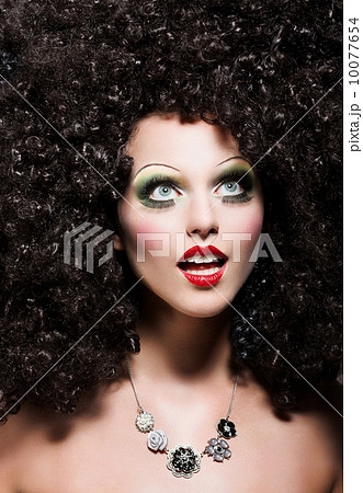 Creativity. Theatrical Emotions. Woman with Fantastic Coiffure looks like Doll 10077654