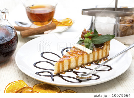 piece of cheese cake on a table in a restaurant piece of cheese cake on a table in a restaurant 10079664