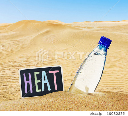 bottle of mineral water on the sand 10080826