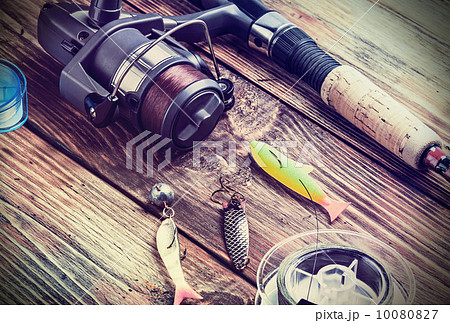 fishing tackle on a wooden table fishing tackle on a wooden table 10080827