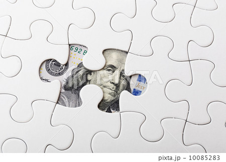 White puzzle and US banknote 10085283