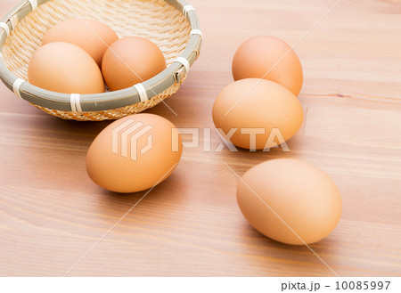 Brown egg in basket Brown egg in basket 10085997