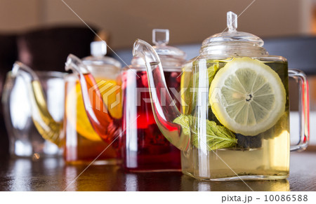 three square teapots with different fruit tastes of tea 10086588