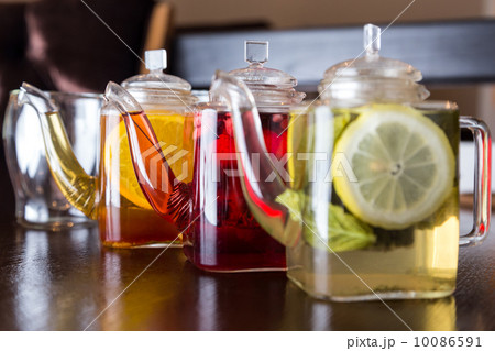 three square teapots with different fruit tastes of tea three square teapots with different fruit tastes of tea 10086591