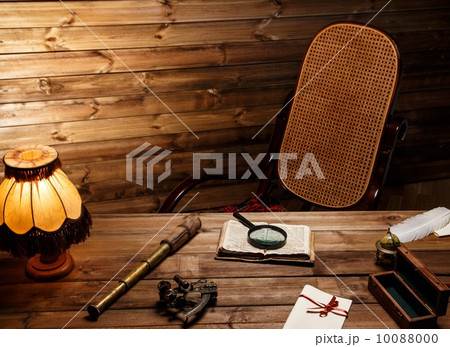 Rocking chair near table in homely wooden interior 10088000