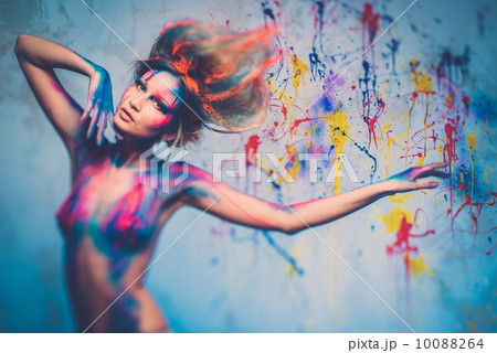 Young woman muse with creative body art and hairdo 10088264