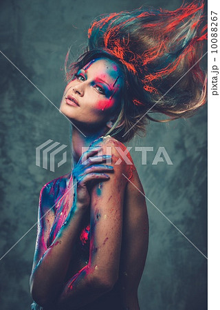 Young woman muse with creative body art and hairdo 10088267