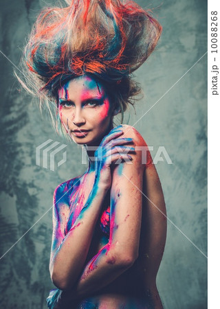 Young woman muse with creative body art and hairdo 10088268