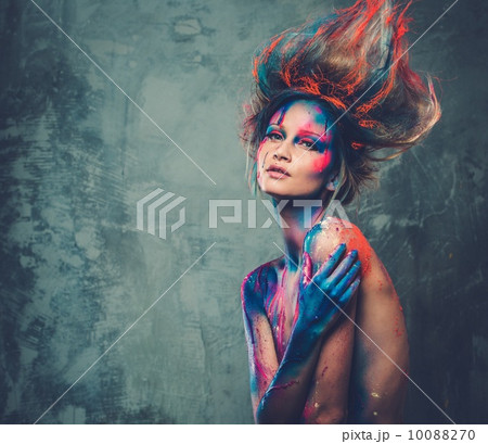 Young woman muse with creative body art and hairdo Young woman muse with creative body art and hairdo 10088270