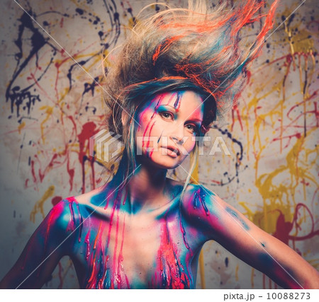 Young woman muse with creative body art and hairdo 10088273