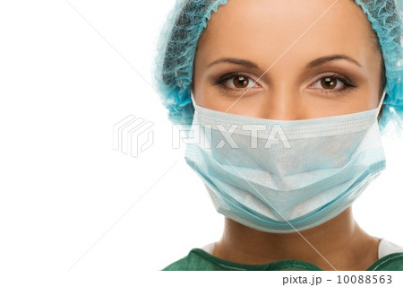 Young woman doctor in cap and face mask 10088563