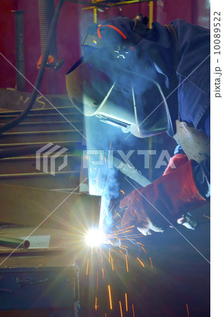 welder with protective mask welding metal 10089522
