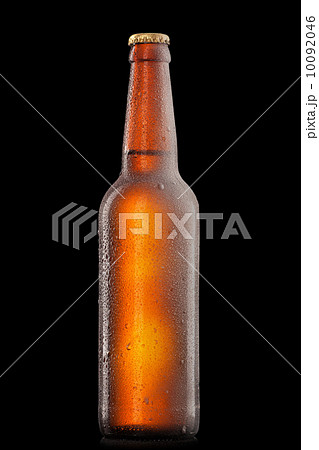Beer bottle with water drops and frost isolated on black 10092046