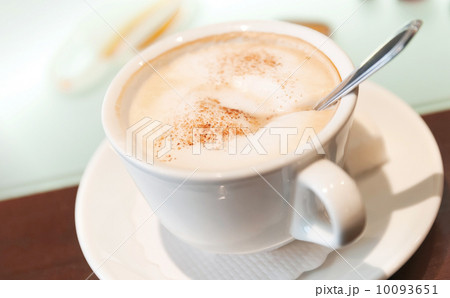 Cup of cappuccino with cinnamon on the table Cup of cappuccino with cinnamon on the table 10093651