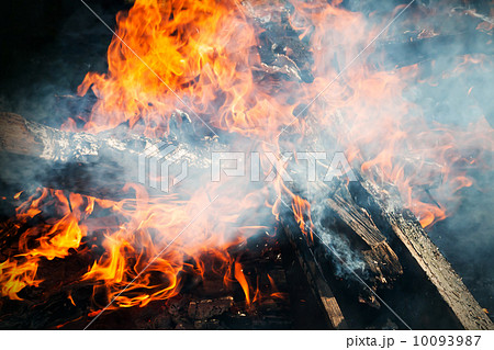 Closeup photo of big outdoor bonfire with smoke 10093987