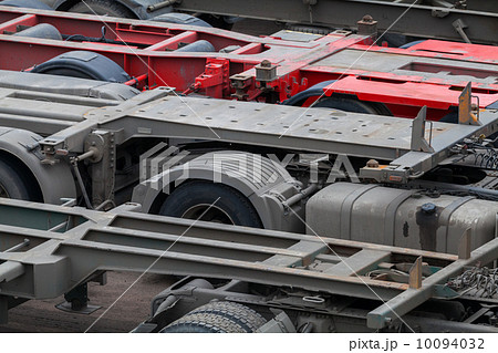 Industrial automotive transportation photo background with empty trucks cargo trailers Industrial automotive transportation photo background with empty trucks cargo trailers 10094032