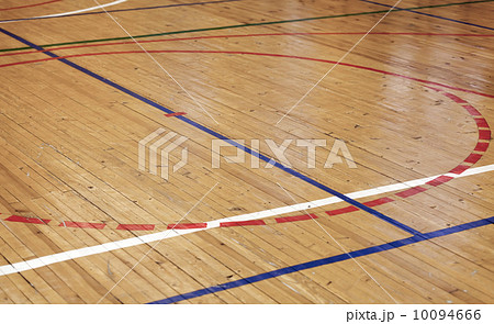 Wooden floor of sports hall with colorful marking lines Wooden floor of sports hall with colorful marking lines 10094666