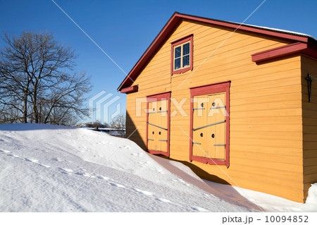 Rural yellow wooden house in winter season with snowdrifts. Rural yellow wooden house in winter season with snowdrifts. 10094852