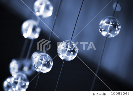 Abstract dark blue background with glass spherical design elements of modern chandelier Abstract dark blue background with glass spherical design elements of modern chandelier 10095045