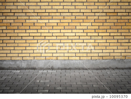Abstract urban courtyard interior with yellow brick wall 10095370