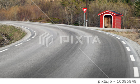 Small red wooden bus stop building in Norway 10095949