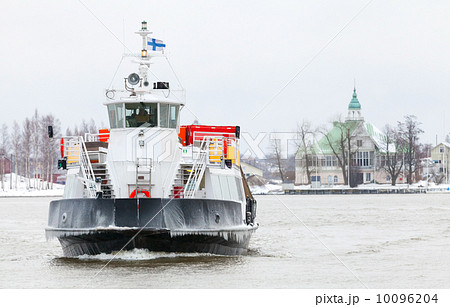 Small passenger ferry enters Helsinki port in winter season 10096204